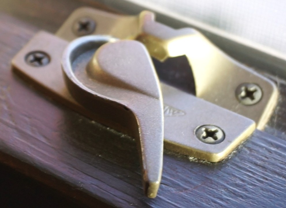 DRAFTeeze installation step 1 – open the crescent lock by swinging the handle to the right